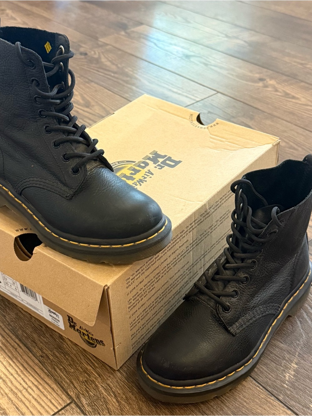 Dr. Martens Black Leather Combat Boots with Yellow Stitching